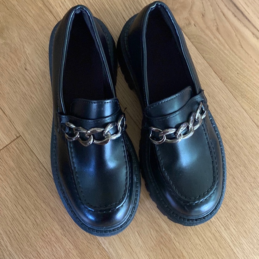 Black faux loafers with silver chain detailing